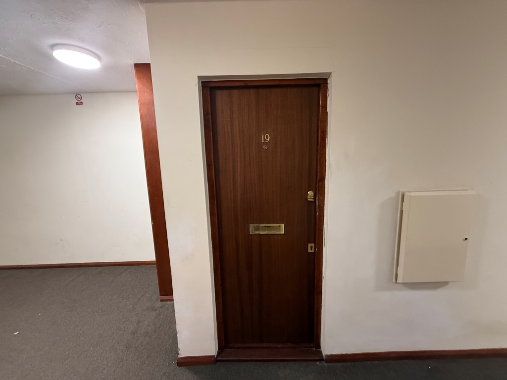 Lot: 219 - ONE-BEDROOM FLAT IN NEED OF MODERNISATION - Front door entering into the flat
